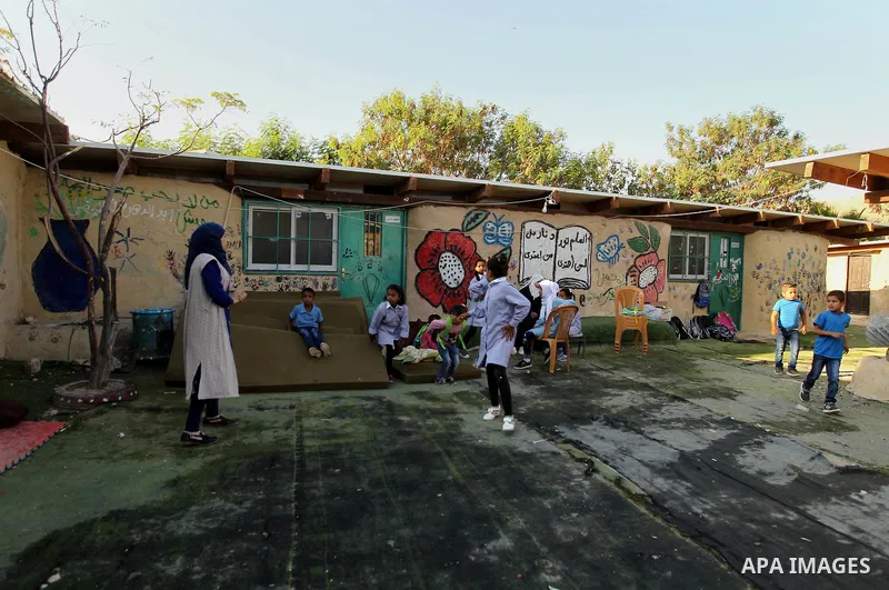 Palestinian Bedouin school children attend morning exercisesin a line at Khan al-Ahmar's school at Khan al-Ahmar's school in the village of Khan al-Ahmar in the Israeli occupied West Bank on September 16, 2018. Photo by...