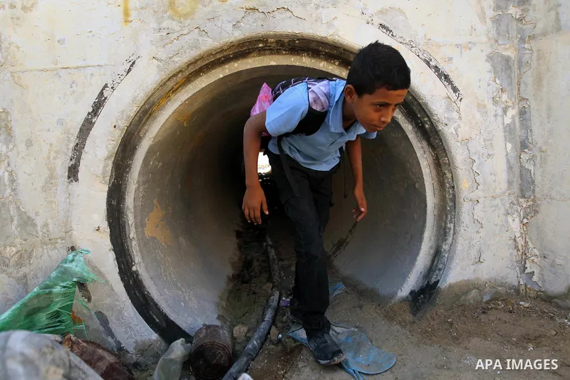A Palestinian Bedouin school boy walks in the village of Khan al-Ahmar in the Israeli occupied West Bank on September 16, 2018. Photo by Wisam Hashlamoun