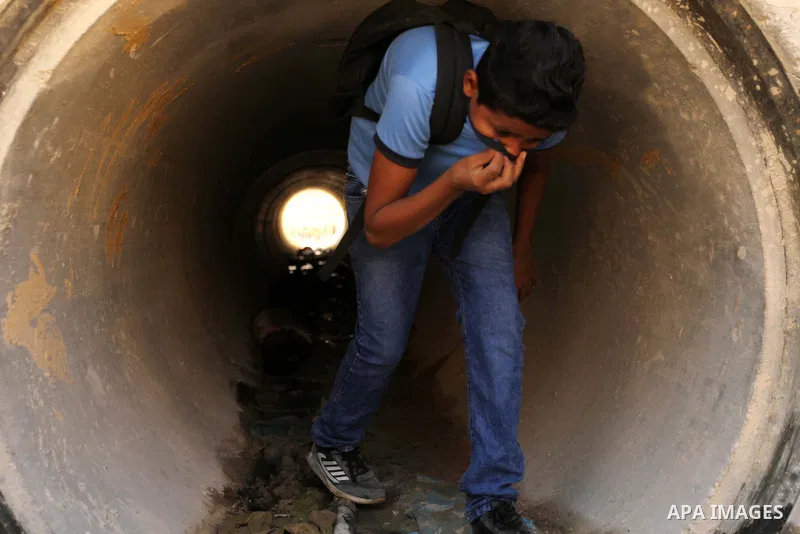 A Palestinian Bedouin school boy walks in the village of Khan al-Ahmar in the Israeli occupied West Bank on September 16, 2018. Photo by Wisam Hashlamoun
