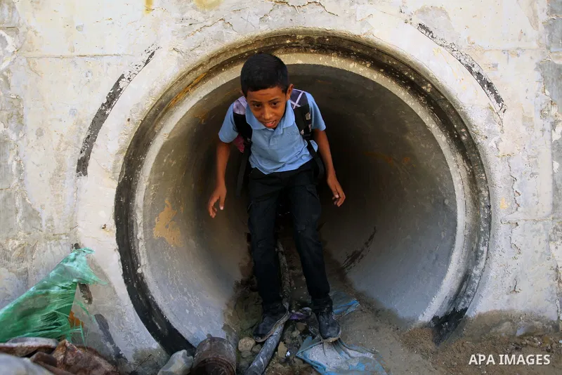 A Palestinian Bedouin school boy walks in the village of Khan al-Ahmar in the Israeli occupied West Bank on September 16, 2018. Photo by Wisam Hashlamoun