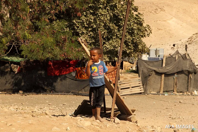 A Palestinian Bedouin boy plays in the village of Khan al-Ahmar in the Israeli occupied West Bank on September 16, 2018. Photo by Wisam Hashlamoun