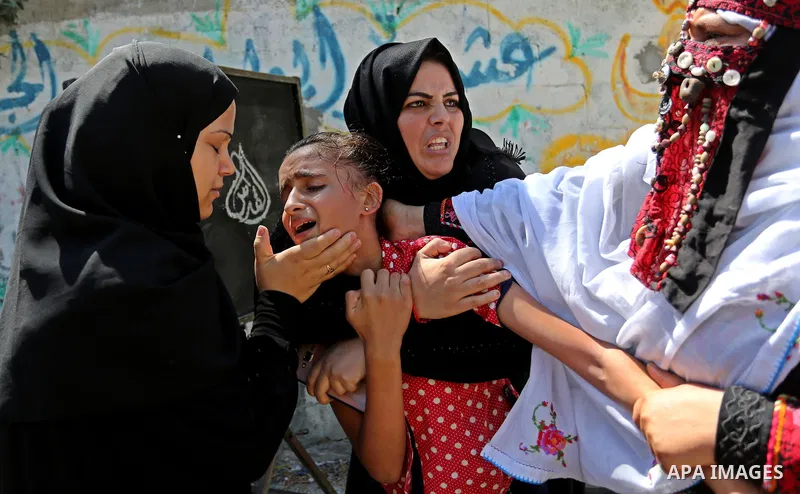 The sister of Palestinian Sohaib Abu Kashef, who died of wounds he sustained, during clashes in tents protest at the Israel-Gaza border, mourns during his funeral in Khan younis in the southern Gaza strip, on September 1...