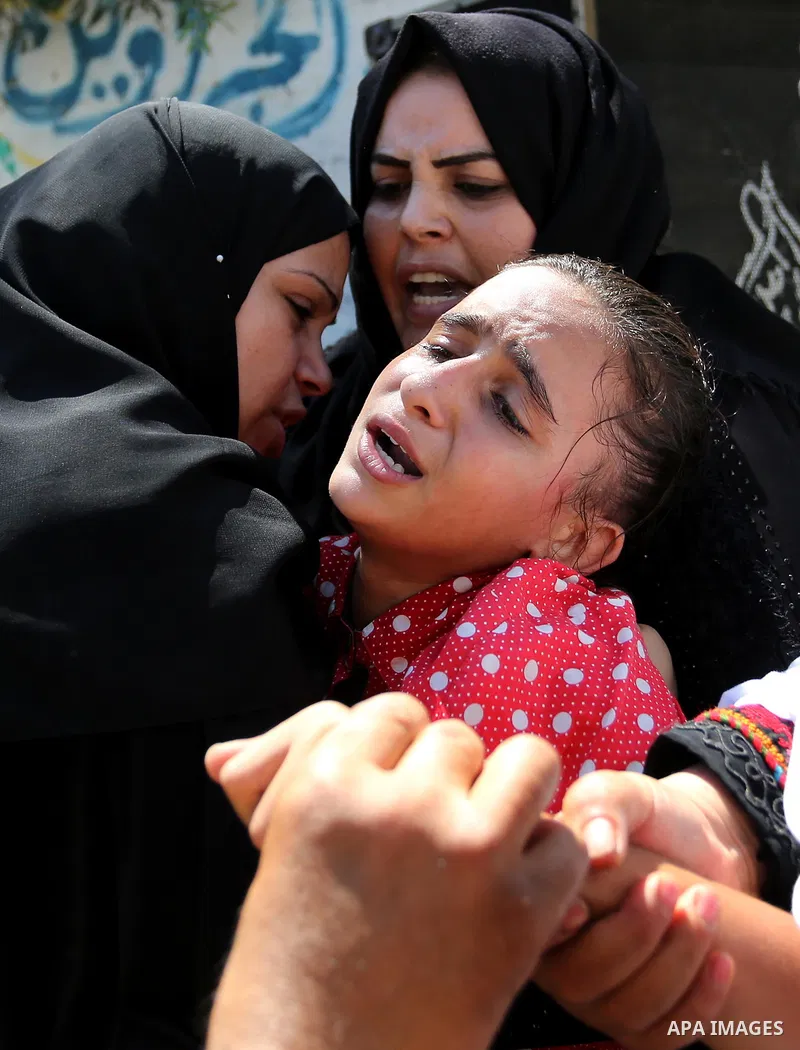 The sister of Palestinian Sohaib Abu Kashef, who died of wounds he sustained, during clashes in tents protest at the Israel-Gaza border, mourns during his funeral in Khan younis in the southern Gaza strip, on September 1...