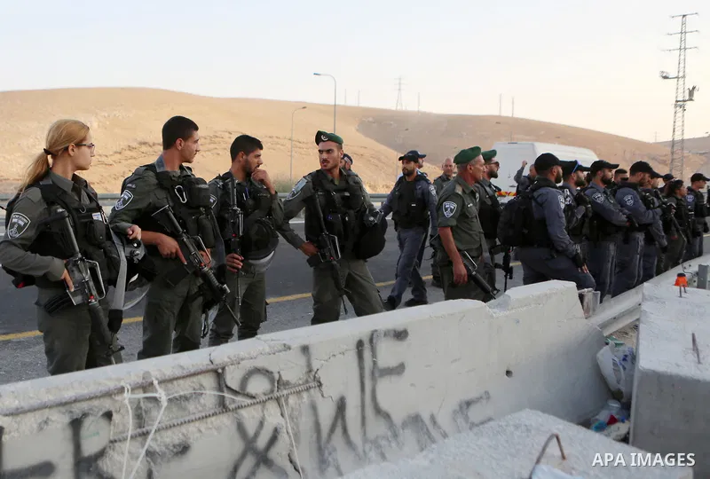 Israeli forces take position during a demonstration by Palestinian protesters against Israel's plan to demolish the Palestinian Bedouin village of Khan al-Ahmar, in the occupied West Bank September 16, 2018. Photo by Sha...