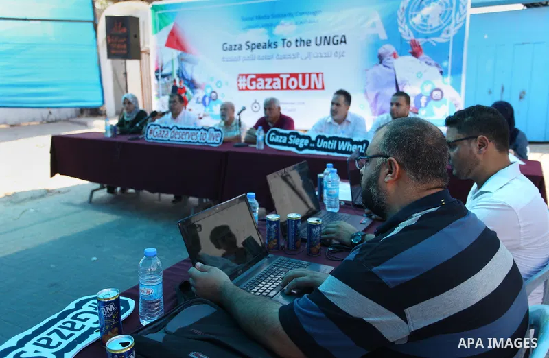 Palestinians take part in the Social Media solidarity Campaign "Gaza Speaks To the UNGA" in front of the headquarter United Nation "UNSCO", in Gaza city on September 17, 2018. Photo by Mahmoud Ajour