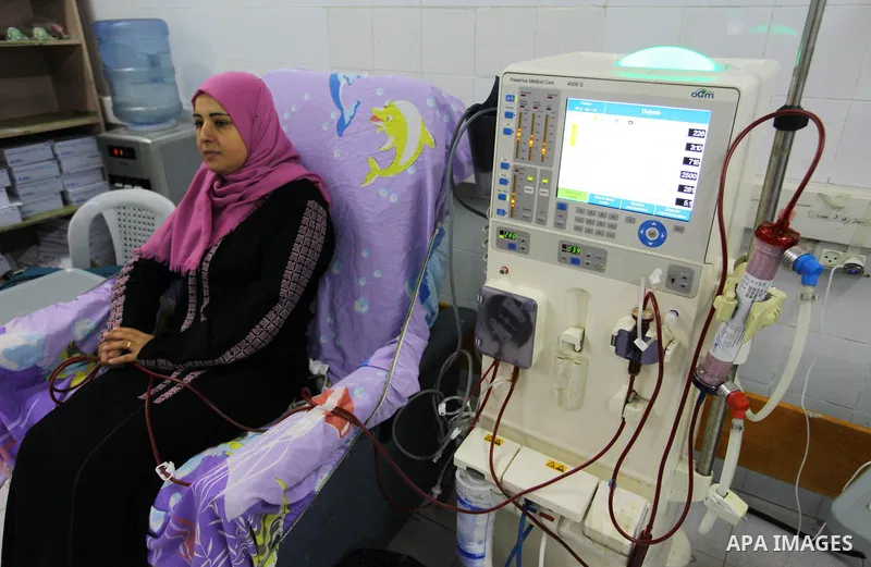 Rima al-draimly ,40, a Palestinian patient makes crochet dresses as she gets her kidneys washed at the dialysis department in the Al-Shifa hospital in Gaza City on September 17, 2018. al-draimly is one of the women who m...
