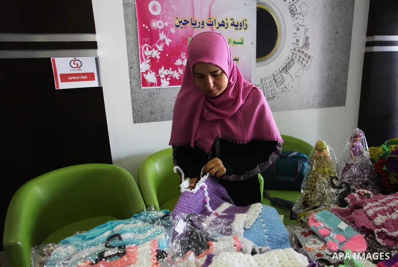 A Palestinian kidney patient, Rima al-draimly ,40, displays her products at an exhibition in Gaza City on September 17, 2018. al-draimly is one of the women who mastered the crochet industry after she participated in a c...
