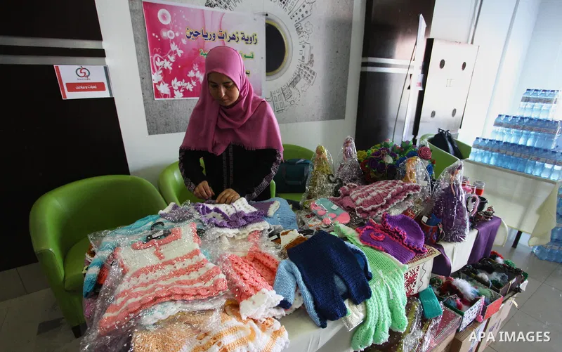 A Palestinian kidney patient, Rima al-draimly ,40, displays her products at an exhibition in Gaza City on September 17, 2018. al-draimly is one of the women who mastered the crochet industry after she participated in a c...