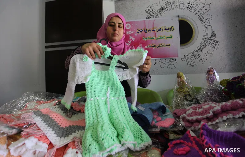 A Palestinian kidney patient, Rima al-draimly ,40, displays her products at an exhibition in Gaza City on September 17, 2018. al-draimly is one of the women who mastered the crochet industry after she participated in a c...
