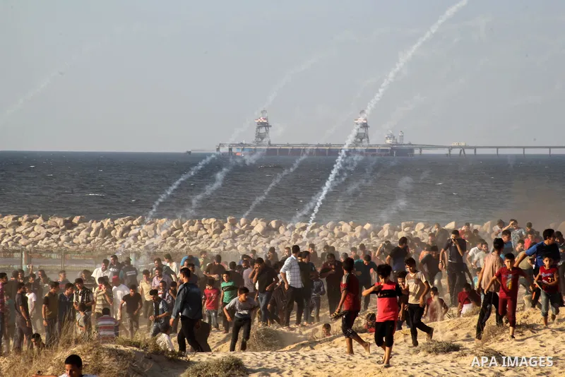 Palestinian protesters gather during clashes with Israeli forces in a demonstration against the Israeli blockade on Gaza Strip, along the Gaza sea barrier on the maritime border with Israel near Kibbutz Zikim, north of B...