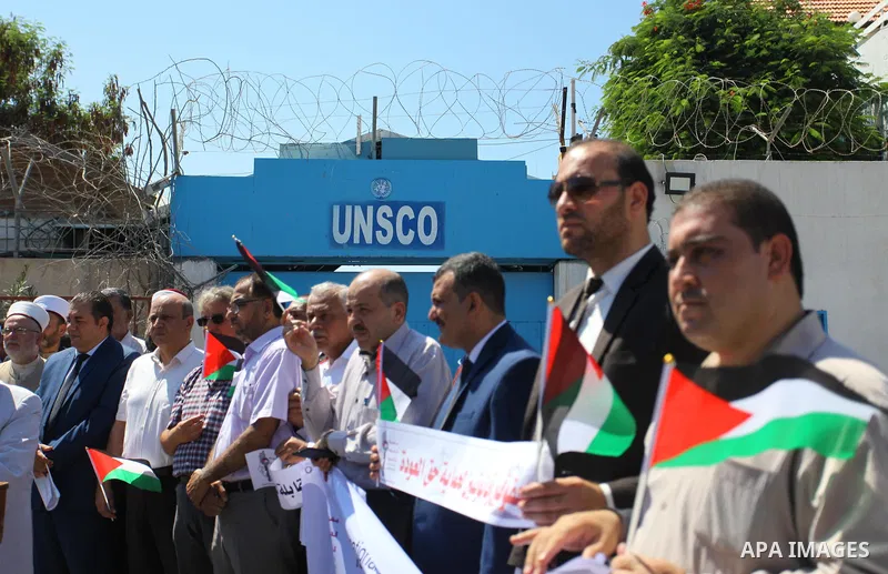 Palestinian members of the National commission for the great return march take part in a protest to demand of the right of return under the banner "Palestinian rights are inalienable" in front of the headquarter United N...