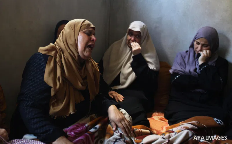 Relatives of Palestinian Ahemd Omar who was shot dead by Israeli troops during a demonstration against Israeli blockade on Gaza Strip, at the Erez crossing with Israel mourn during his funeral at el-Shati refugee camp in...