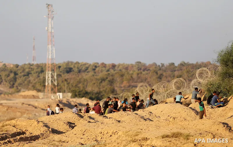 Palestinian protesters gather during clashes with Israeli forces in tents protest where Palestinians demand the right to return to their homeland at the Israel-Gaza border, in Deir al-Balah in the center of Gaza Strip on...