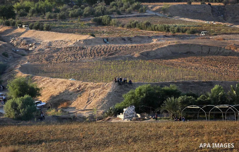 Palestinian protesters gather during clashes with Israeli forces in tents protest where Palestinians demand the right to return to their homeland at the Israel-Gaza border, in Deir al-Balah in the center of Gaza Strip on...