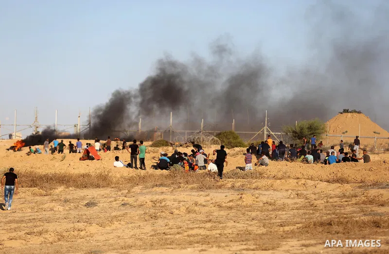 Palestinian protesters gather during clashes with Israeli forces in tents protest where Palestinians demand the right to return to their homeland at the Israel-Gaza border, in Deir al-Balah in the center of Gaza Strip on...