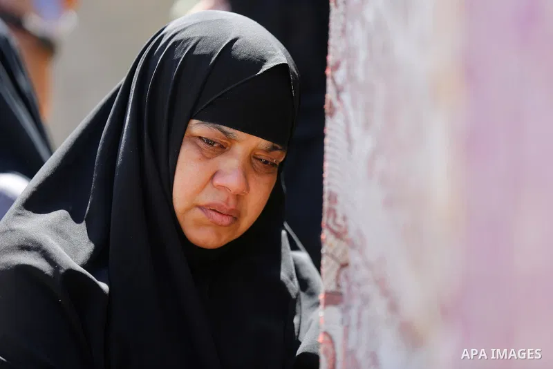 A relative of Palestinian Mo'men Abu Eyada 15, who was shot dead by Israeli troops during clashes in tents protest at the Israel-Gaza border, mourns during his funeral in Rafah in the southern Gaza Strip on September 20,...