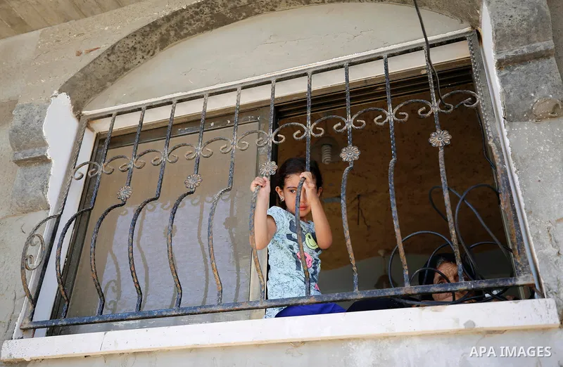 Relatives of Palestinian Mo'men Abu Eyada 15, who was shot dead by Israeli troops during clashes in tents protest at the Israel-Gaza border, mourn during his funeral in Rafah in the southern Gaza Strip on September 20, 2...