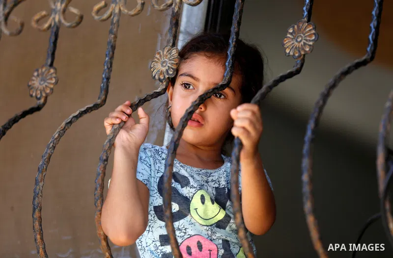 A relative of Palestinian Mo'men Abu Eyada 15, who was shot dead by Israeli troops during clashes in tents protest at the Israel-Gaza border, mourns during his funeral in Rafah in the southern Gaza Strip on September 20,...