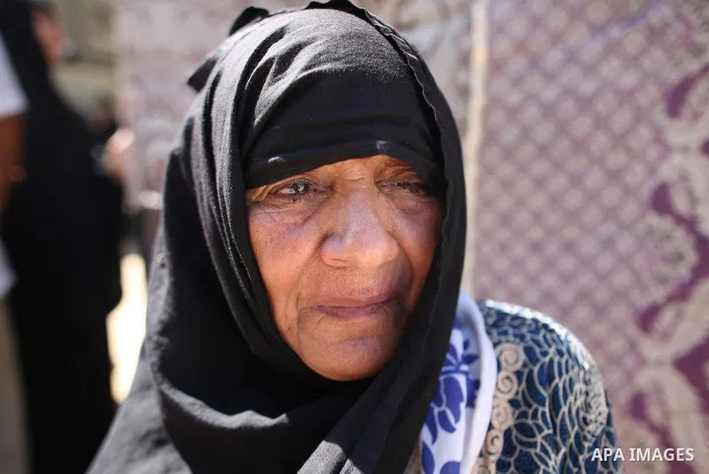 A relative of Palestinian Mo'men Abu Eyada 15, who was shot dead by Israeli troops during clashes in tents protest at the Israel-Gaza border, mourns during his funeral in Rafah in the southern Gaza Strip on September 20,...
