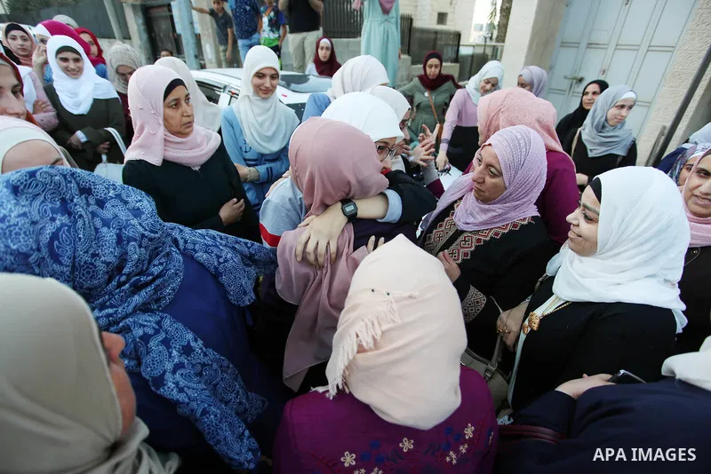 Palestinian student Ola Marshoud is greeted by relatives and friends at the Israeli checkpoint of Al-Jalameh, south of the West Bank city of Jenin following her release from an Israeli jail on September 20, 2018 after se...