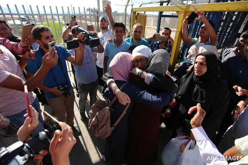 Palestinian student Ola Marshoud is greeted by relatives and friends at the Israeli checkpoint of Al-Jalameh, south of the West Bank city of Jenin following her release from an Israeli jail on September 20, 2018 after se...