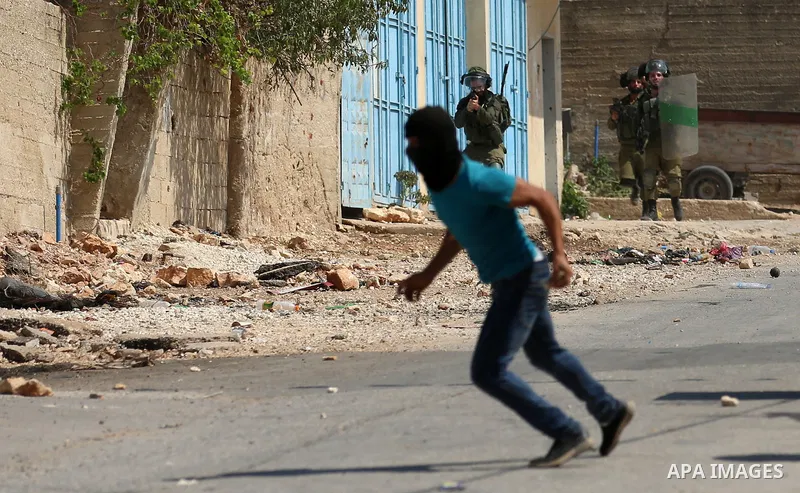Israeli forces take position during clashes with Palestinian protesters following a weekly demonstration against the expropriation of Palestinian land by Israel in the village of Kfar Qaddum, near the West Bank city of N...