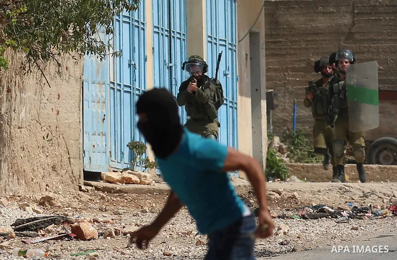 Israeli forces take position during clashes with Palestinian protesters following a weekly demonstration against the expropriation of Palestinian land by Israel in the village of Kfar Qaddum, near the West Bank city of N...