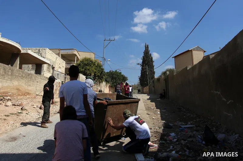 Palestinian protesters hurl stones towards Israeli forces during clashes following a weekly demonstration against the expropriation of Palestinian land by Israel in the village of Kfar Qaddum, near the West Bank city of...