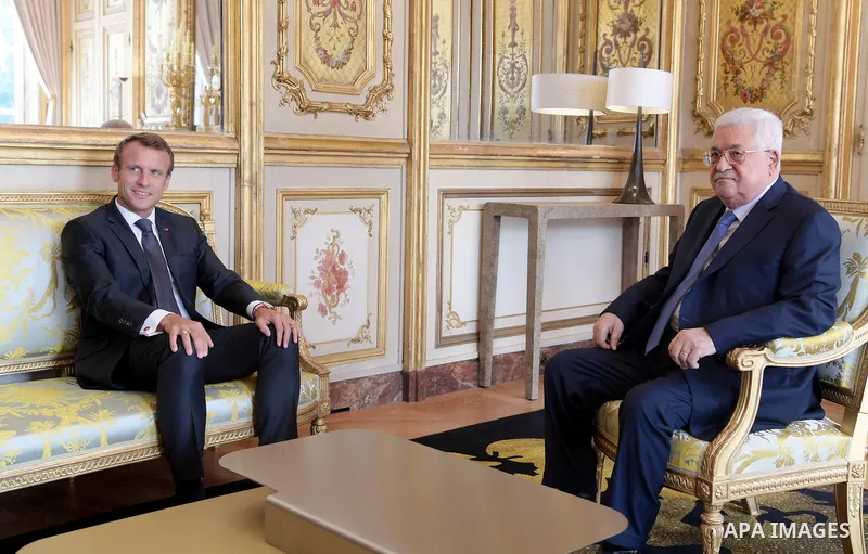 Palestinian President Mahmoud Abbas meets with French President Emmanuel Macron at the Elysee Palace in Paris, France, on September 21, 2018. Photo by Thaer Ganaim