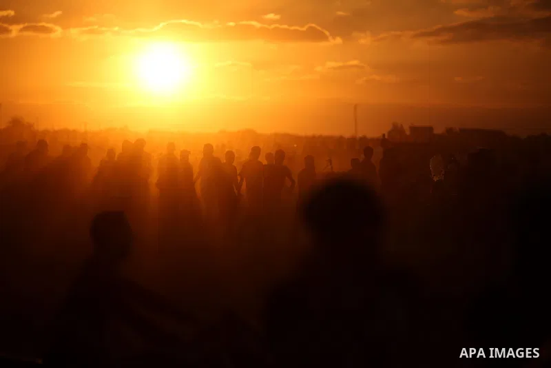 Palestinian protesters gather during clashes with Israeli troops in tents protest where Palestinians demand the right to return to their homeland at the Israel-Gaza border, in east of Gaza City on September 21, 2018. Pho...