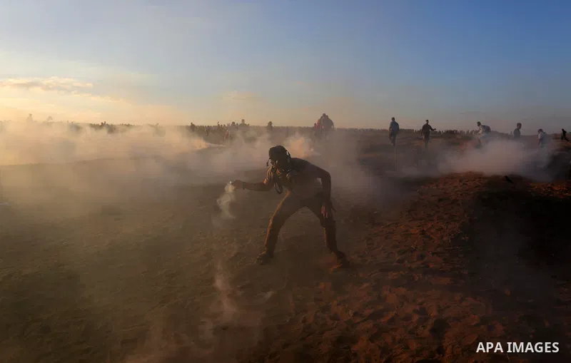 Palestinian protesters gather during clashes with Israeli troops in tents protest where Palestinians demand the right to return to their homeland at the Israel-Gaza border, in Khan Younis in the southern of Gaza Strip on...