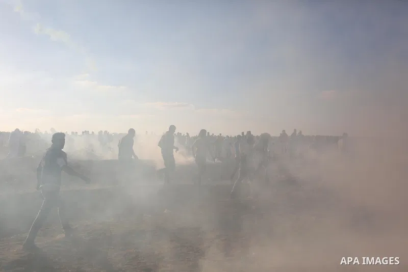 Palestinian protesters gather during clashes with Israeli troops in tents protest where Palestinians demand the right to return to their homeland at the Israel-Gaza border, in Khan Younis in the southern of Gaza Strip on...