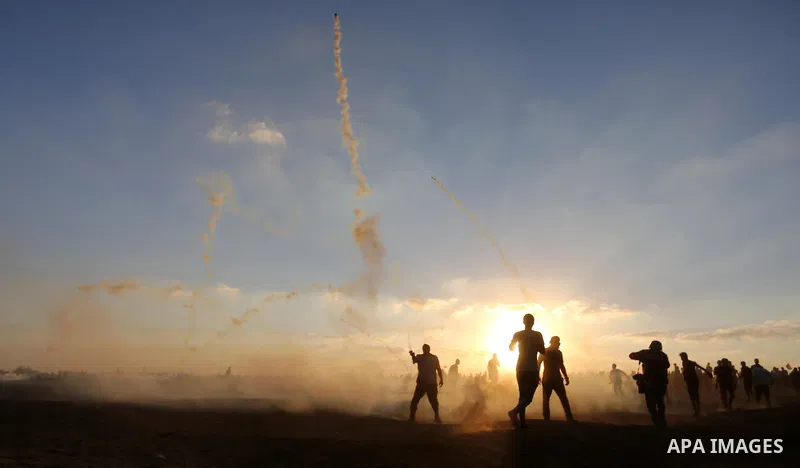 Palestinian protesters gather during clashes with Israeli troops in tents protest where Palestinians demand the right to return to their homeland at the Israel-Gaza border, in Khan Younis in the southern of Gaza Strip on...