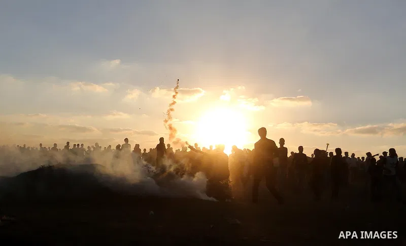 Palestinian protesters gather during clashes with Israeli troops in tents protest where Palestinians demand the right to return to their homeland at the Israel-Gaza border, in Khan Younis in the southern of Gaza Strip on...