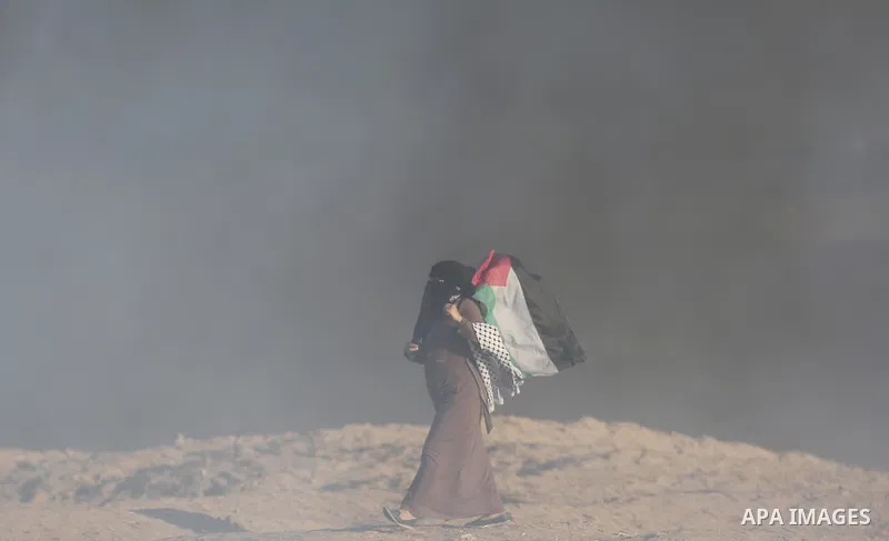 Palestinian protesters gather during clashes with Israeli troops in tents protest where Palestinians demand the right to return to their homeland at the Israel-Gaza border, in Khan Younis in the southern of Gaza Strip on...
