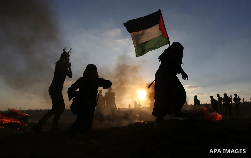 Palestinian protesters gather during clashes with Israeli troops in tents protest where Palestinians demand the right to return to their homeland at the Israel-Gaza border, in Khan Younis in the southern of Gaza Strip on...