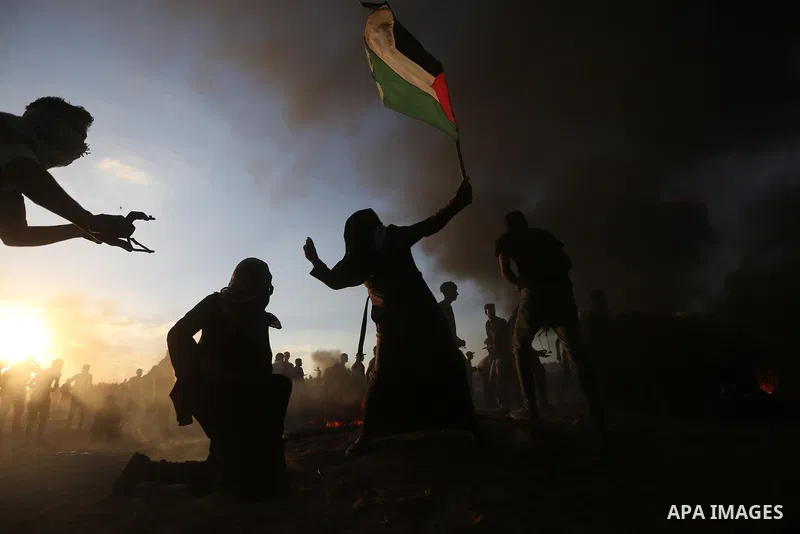Palestinian protesters gather during clashes with Israeli troops in tents protest where Palestinians demand the right to return to their homeland at the Israel-Gaza border, in Khan Younis in the southern of Gaza Strip on...