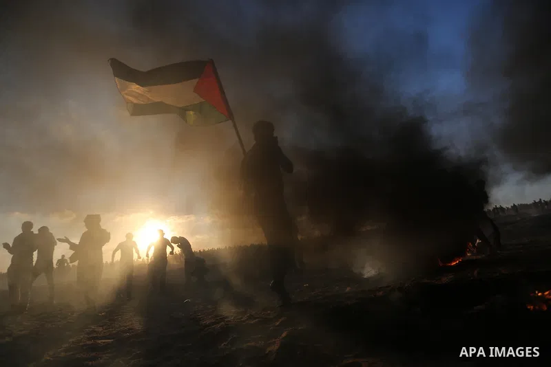 Palestinian protesters gather during clashes with Israeli troops in tents protest where Palestinians demand the right to return to their homeland at the Israel-Gaza border, in Khan Younis in the southern of Gaza Strip on...