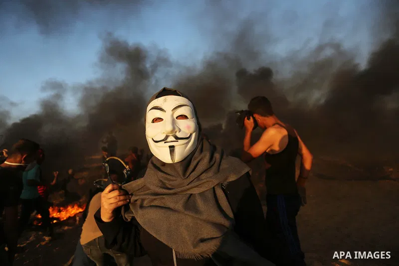 Palestinian protesters gather during clashes with Israeli troops in tents protest where Palestinians demand the right to return to their homeland at the Israel-Gaza border, in Khan Younis in the southern of Gaza Strip on...