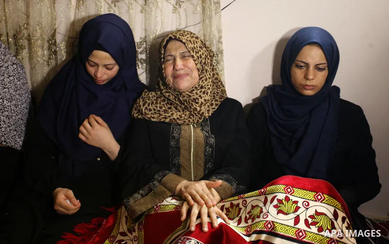 Relatives of Palestinian Kareem Kullab, 25, who was shot dead by Israeli forces during clashes in tents protest where Palestinians demand the right to return to their homeland at the Israel-Gaza border, mourn during his...