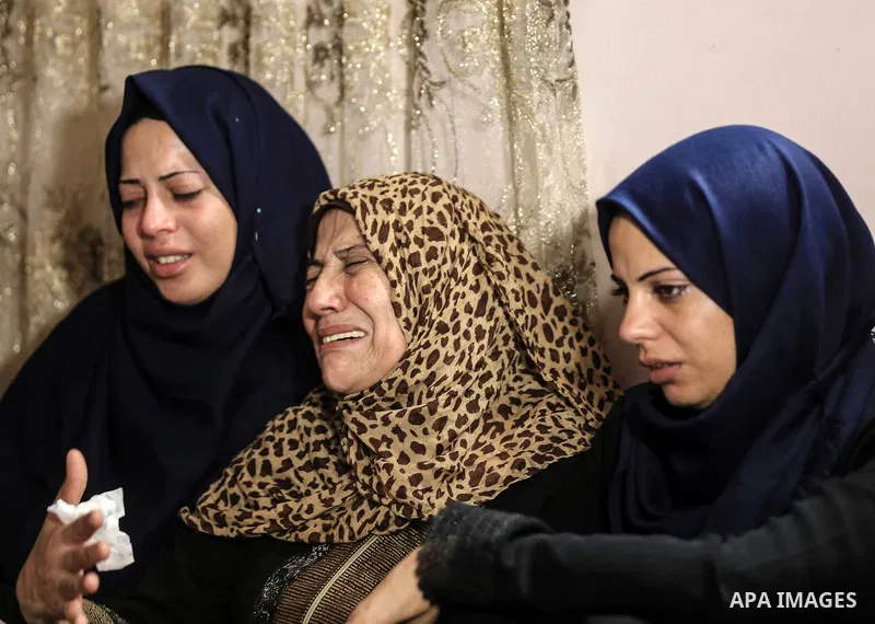 Relatives of Palestinian Kareem Kullab, 25, who was shot dead by Israeli forces during clashes in tents protest where Palestinians demand the right to return to their homeland at the Israel-Gaza border, mourn during his...