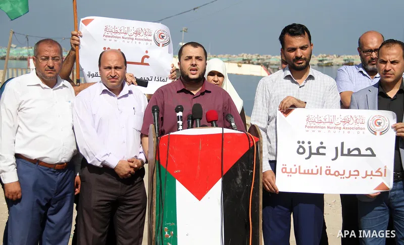 Palestinian members of the National Commission to break the siege, attend a press conference at the seaport in Gaza city on September 23, 2018. Photo by Mahmoud Ajour