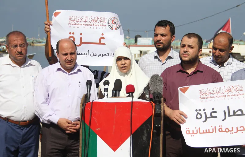 Palestinian members of the National Commission to break the siege, attend a press conference at the seaport in Gaza city on September 23, 2018. Photo by Mahmoud Ajour