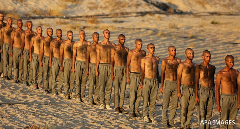Palestinian students show off their military skills during a training at al-Rebat College for Law and Police Science in Khan Younis in the southern of Gaza Strip, on September 23, 2018. Photo by Atia Darwish
