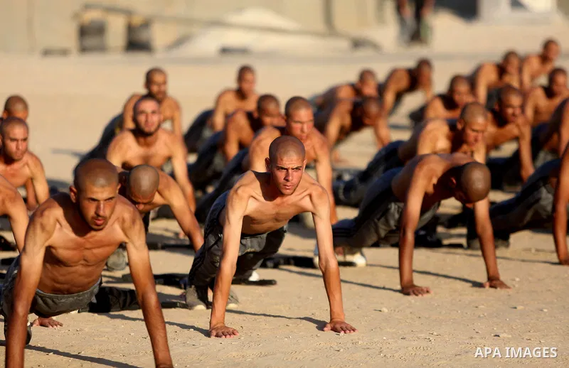 Palestinian students show off their military skills during a training at al-Rebat College for Law and Police Science in Khan Younis in the southern of Gaza Strip, on September 23, 2018. Photo by Atia Darwish