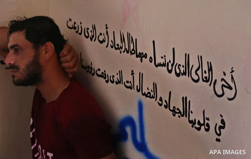 A relative of Palestinian Mohamed Abu Sadek, 21, who was shot dead by Israeli forces during clashes at the Israel-Gaza border, mourns during his funeral in Gaza City on September 25, 2018. Photo by Ashraf Amra