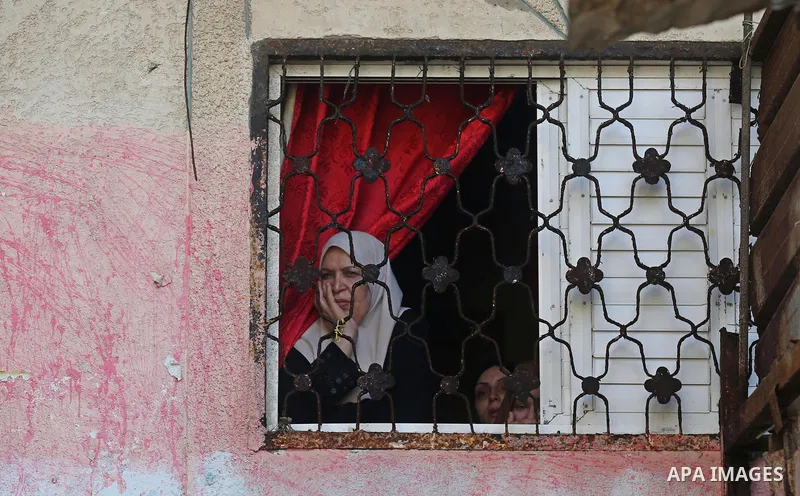 A relative of Palestinian Mohamed Abu Sadek, 21, who was shot dead by Israeli forces during clashes at the Israel-Gaza border, mourns during his funeral in Gaza City on September 25, 2018. Photo by Ashraf Amra