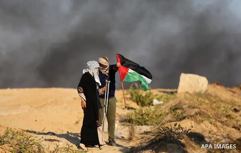 Palestinian protesters gather during clashes with Israeli forces in a demonstration against the Israeli blockade on Gaza Strip, along the Gaza sea barrier on the maritime border with Israel near Kibbutz Zikim, north of B...