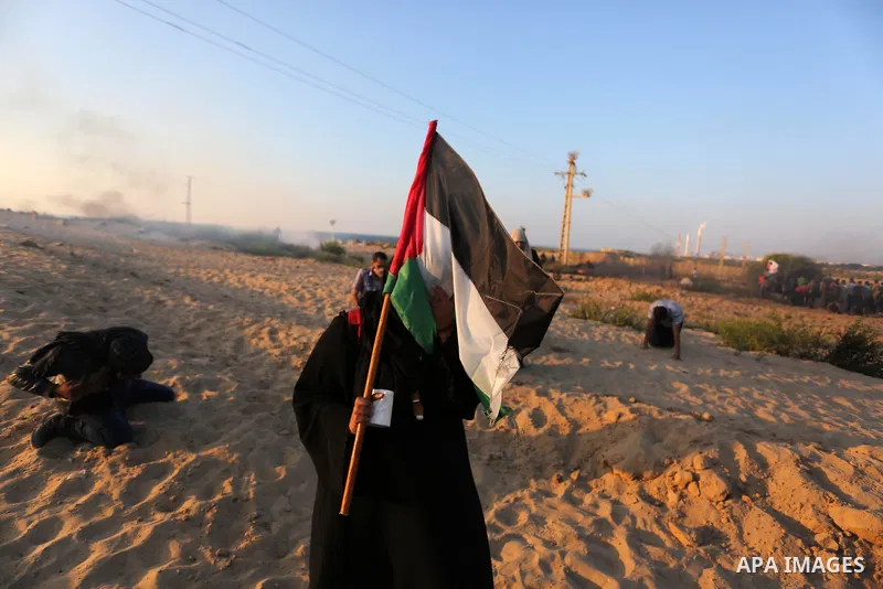 Palestinian protesters gather during clashes with Israeli forces in a demonstration against the Israeli blockade on Gaza Strip, along the Gaza sea barrier on the maritime border with Israel near Kibbutz Zikim, north of B...