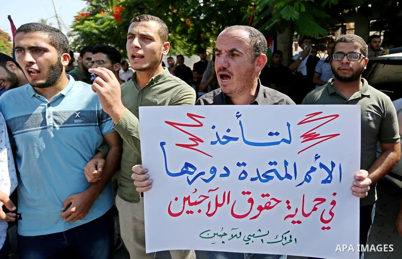 Palestinians take part during a protest against the United States decision earlier this year to stop funding and backing the United Nations Relief and Works Agency (UNRWA), in conjunction of the General Debate of the 73r...